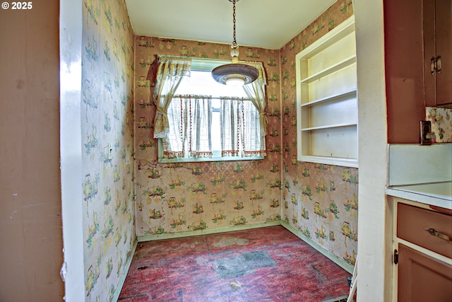 unfurnished dining area featuring built in features