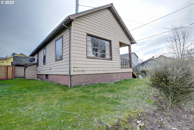 view of home's exterior featuring a yard