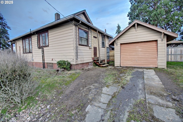 view of front of house with an outbuilding and a garage