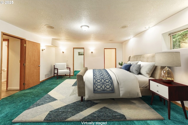 carpeted bedroom with a textured ceiling