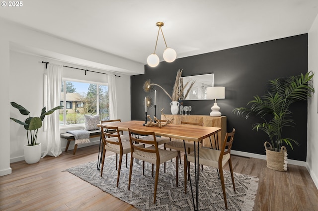 dining area featuring wood-type flooring