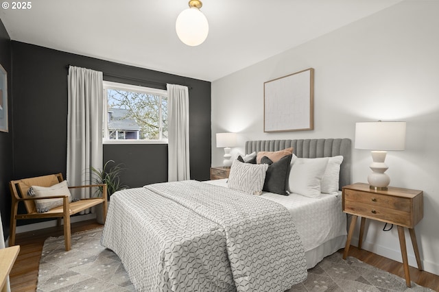 bedroom with wood-type flooring