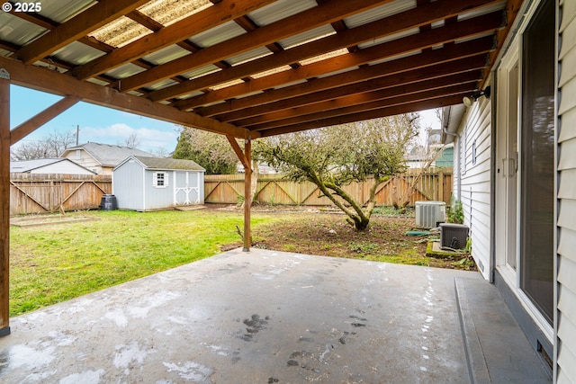 view of patio / terrace with a storage shed and central air condition unit