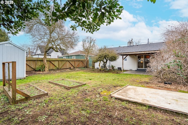 view of yard with a patio and a shed