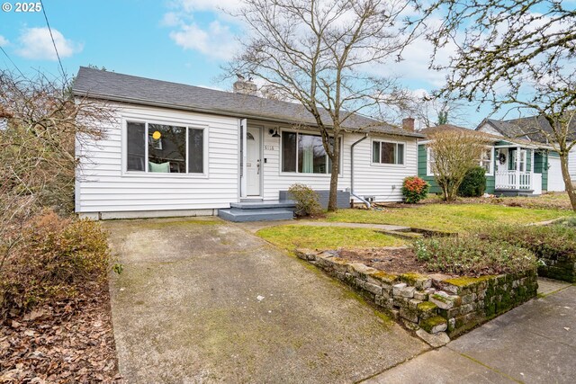 ranch-style house with a front lawn