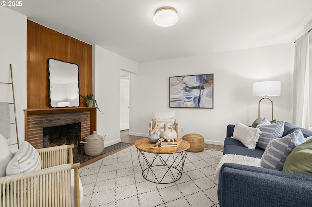 living room with a fireplace and light hardwood / wood-style flooring