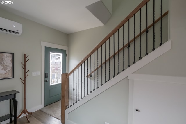 entrance foyer with light hardwood / wood-style floors and a wall unit AC