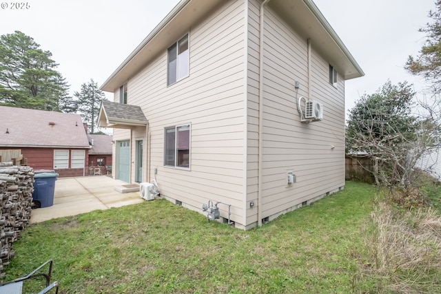 rear view of house featuring a patio area and a lawn