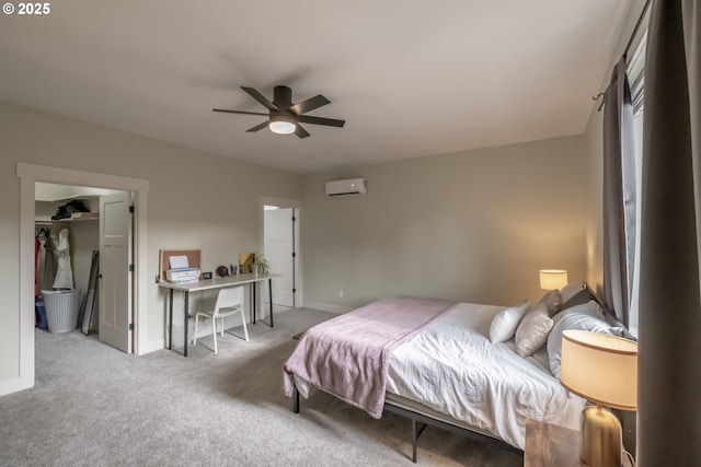 bedroom with ceiling fan, a wall mounted AC, and light carpet