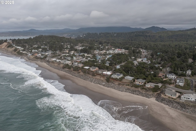 drone / aerial view featuring a water and mountain view