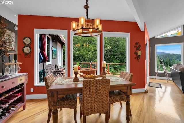 6027 View Loop, Florence, OR 97439 - dining space featuring a chandelier, light wood-style floors, healthy amount of natural light, and lofted ceiling