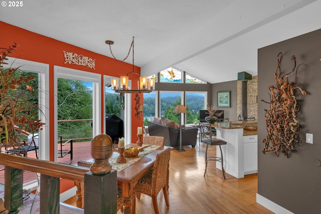 6027 View Loop, Florence, OR 97439 - dining space featuring a chandelier, plenty of natural light, lofted ceiling, and light wood-style floors
