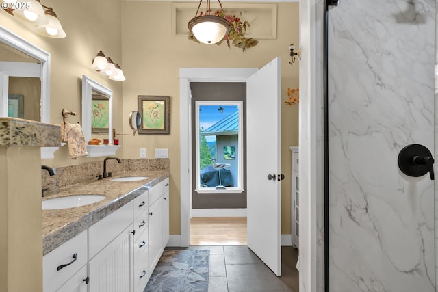 6027 View Loop, Florence, OR 97439 - bathroom with double vanity, a marble finish shower, and tile patterned floors