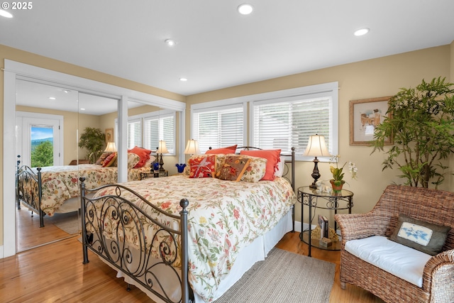 6027 View Loop, Florence, OR 97439 - bedroom with light wood-style floors, recessed lighting, and two closets
