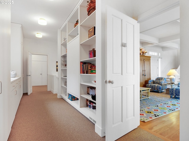 766 Neacoxie Blvd, Gearhart, OR 97138 - hallway with carpet, built in features, and beam ceiling