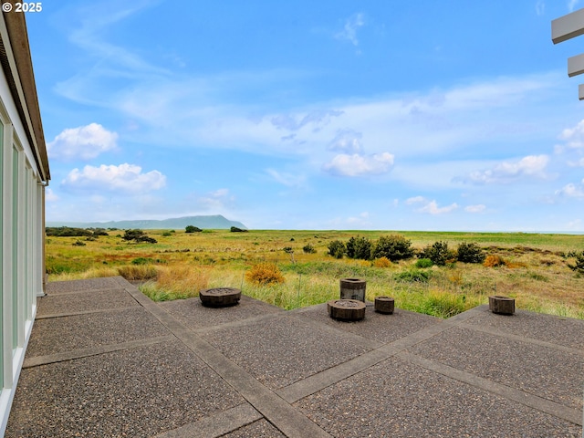766 Neacoxie Blvd, Gearhart, OR 97138 - view of patio with an outdoor fire pit and a rural view