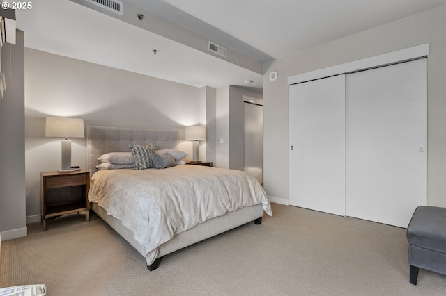 carpeted bedroom with a closet