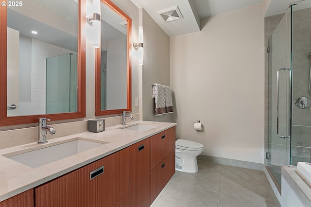 bathroom with walk in shower, tile patterned floors, vanity, and toilet