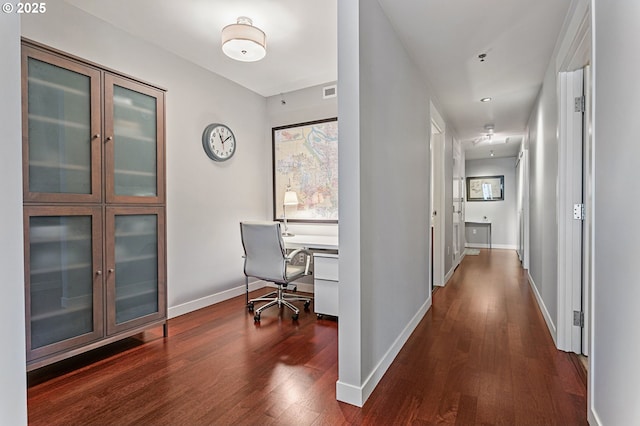 hallway with dark wood-type flooring