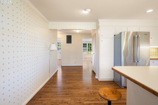 2160 Oakmont Way, Eugene, OR 97401 - kitchen featuring wallpapered walls, high end refrigerator, ornamental molding, light wood finished floors, and white cabinetry