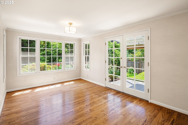 2160 Oakmont Way, Eugene, OR 97401 - spare room with ornamental molding, healthy amount of natural light, wood finished floors, and french doors