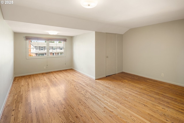 2160 Oakmont Way, Eugene, OR 97401 - unfurnished room with light wood-style flooring and vaulted ceiling