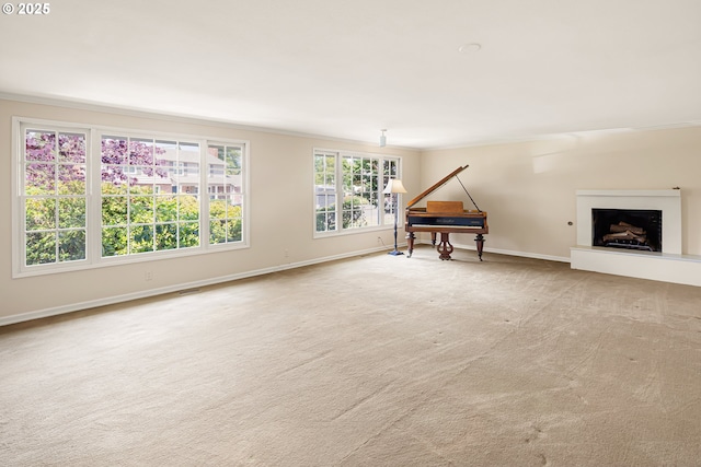 2160 Oakmont Way, Eugene, OR 97401 - unfurnished living room featuring carpet floors, a fireplace with raised hearth, and ornamental molding