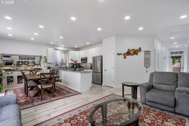 19577 SW Treehouse Ln, Beaverton, OR 97078 - living room featuring light wood-style flooring and recessed lighting