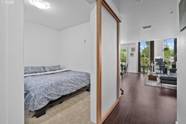 838 SE 38th Ave Unit 311, Portland, OR 97214 - bedroom with wood finished floors and baseboards