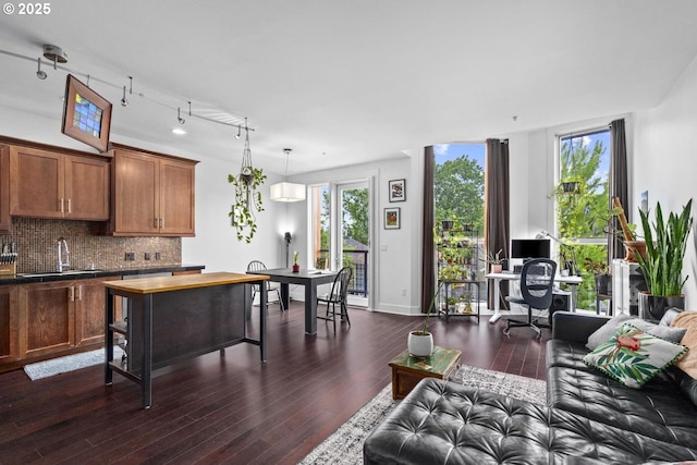 838 SE 38th Ave Unit 311, Portland, OR 97214 - living area with dark wood-type flooring, an office area, and baseboards