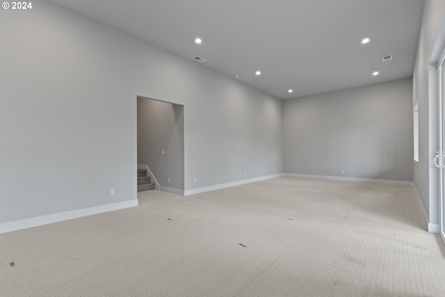 spare room with light colored carpet