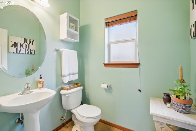 1146 SE Millright Ave, Mcminnville, OR 97128 - bathroom featuring toilet, baseboards, wood finished floors, and a sink