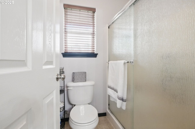 1146 SE Millright Ave, Mcminnville, OR 97128 - bathroom featuring a shower stall, toilet, and tile patterned flooring