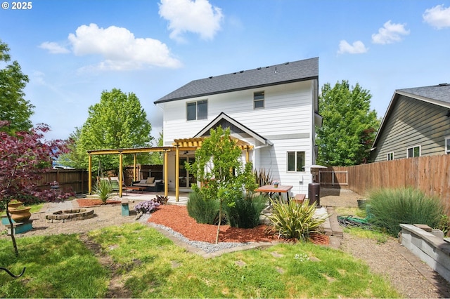 1146 SE Millright Ave, Mcminnville, OR 97128 - back of property featuring a fire pit, a patio area, a fenced backyard, a pergola, and a shingled roof