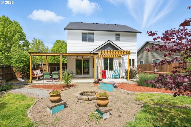 1146 SE Millright Ave, Mcminnville, OR 97128 - back of property featuring a pergola, a patio area, a fire pit, and a fenced backyard