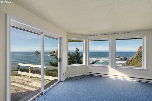 unfurnished sunroom featuring a water view and a baseboard radiator