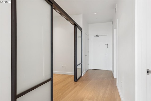 949 NW Overton St Unit 1007, Portland, OR 97209 - corridor featuring light wood-style floors and baseboards