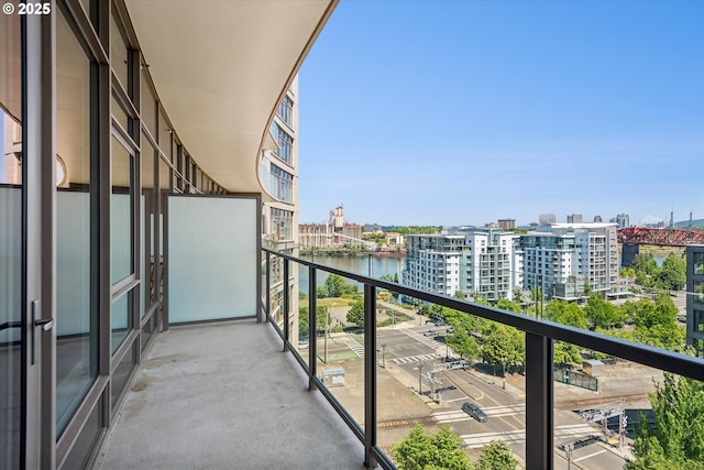 949 NW Overton St Unit 1007, Portland, OR 97209 - balcony featuring a city view and a water view