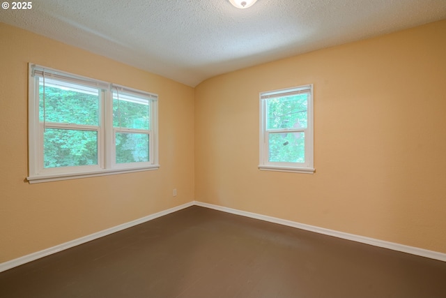3211 E 17th St, Vancouver, WA 98661 - spare room with plenty of natural light, a textured ceiling, and dark wood-style floors