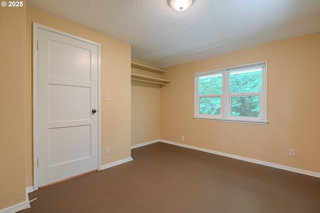 3211 E 17th St, Vancouver, WA 98661 - unfurnished bedroom featuring a textured ceiling and baseboards