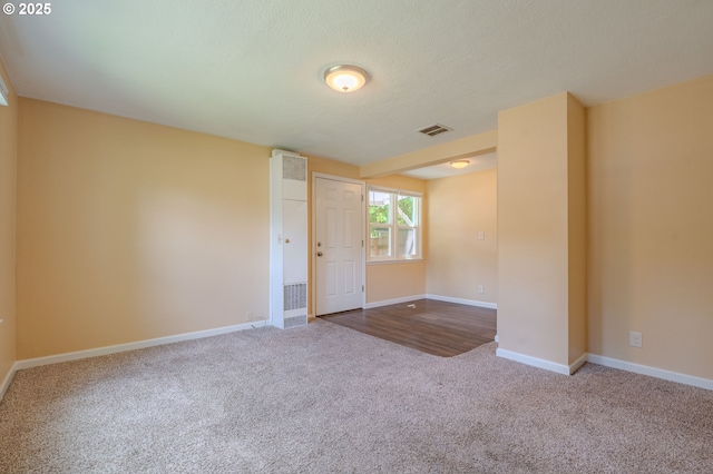 3211 E 17th St, Vancouver, WA 98661 - empty room with carpet floors, a heating unit, and a textured ceiling
