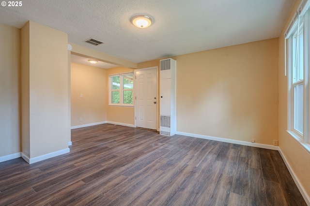 3211 E 17th St, Vancouver, WA 98661 - unfurnished room featuring dark wood-style flooring and a textured ceiling