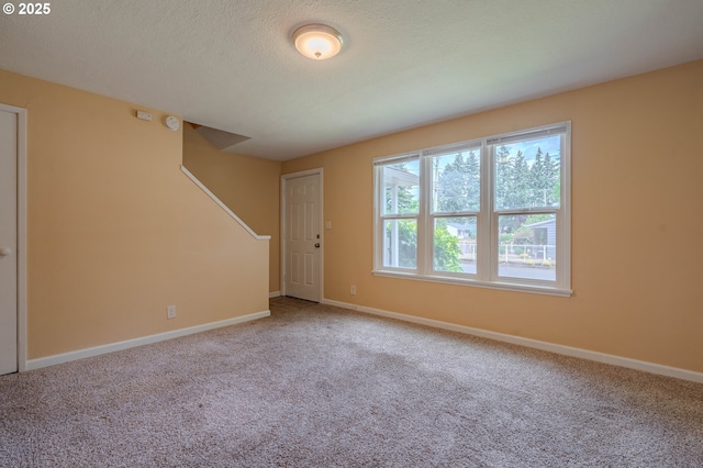 3211 E 17th St, Vancouver, WA 98661 - unfurnished room featuring carpet flooring, stairs, and a textured ceiling
