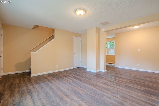 3211 E 17th St, Vancouver, WA 98661 - unfurnished living room with wood finished floors, stairs, and a textured ceiling