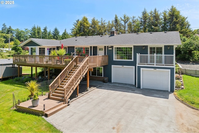 35111 Jefferson Ln, Astoria, OR 97103 - single story home with a wooden deck, driveway, a garage, and stairway