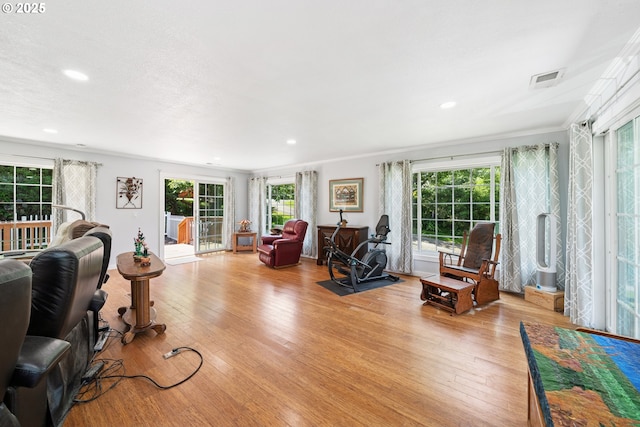 35111 Jefferson Ln, Astoria, OR 97103 - living room with light wood-type flooring, recessed lighting, and ornamental molding