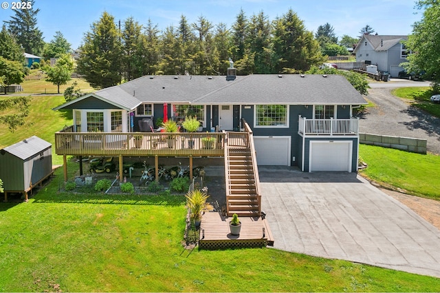 35111 Jefferson Ln, Astoria, OR 97103 - back of property with an attached garage, stairs, asphalt driveway, a yard, and a deck