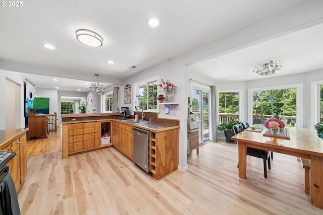 35111 Jefferson Ln, Astoria, OR 97103 - kitchen with dishwasher, light wood-style flooring, a peninsula, recessed lighting, and brown cabinetry