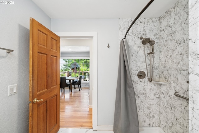 35111 Jefferson Ln, Astoria, OR 97103 - bathroom with a marble finish shower and wood finished floors