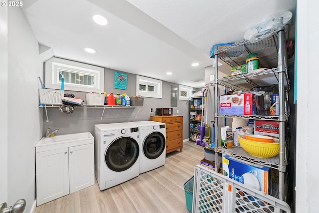 35111 Jefferson Ln, Astoria, OR 97103 - laundry room with separate washer and dryer, light wood-style floors, and recessed lighting